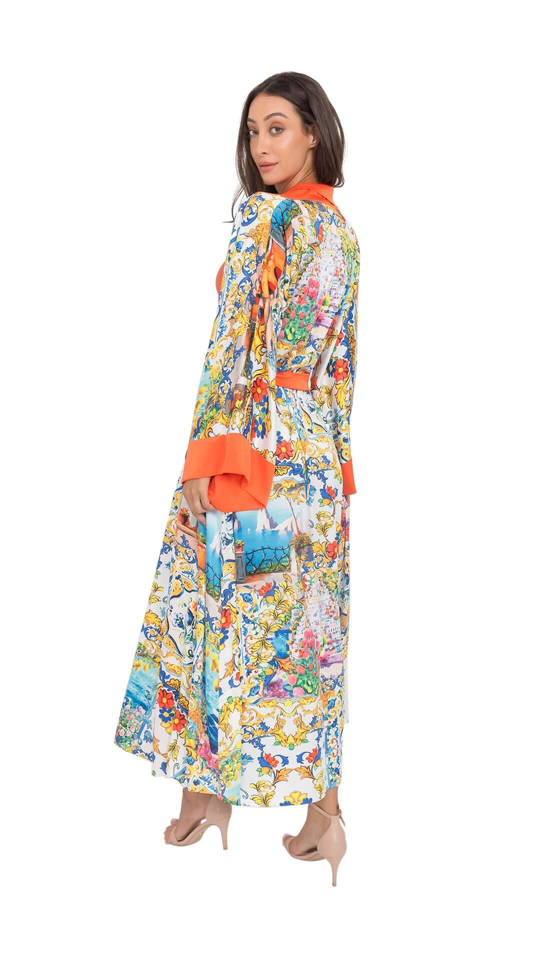 Model showcasing the colorful Capri Long Robe with a stylish orange belt, highlighting its relaxed fit and vibrant pattern.