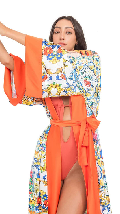 Model wearing the CAPRI Long Robe with belt, showcasing a relaxed fit in vibrant colors, perfect for exclusive resort wear.